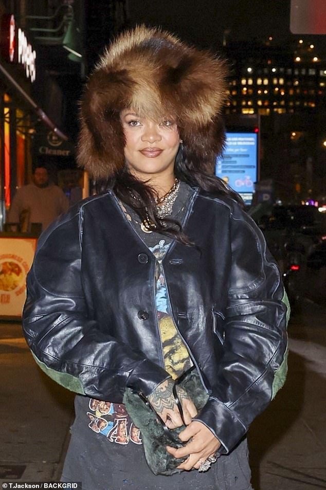 For her outing, she sported a vintage and distressed Tupac T-shirt, which she layered with a cropped, button-up leather jacket