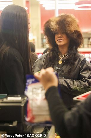 They appeared deep in conversation in the checkout lane